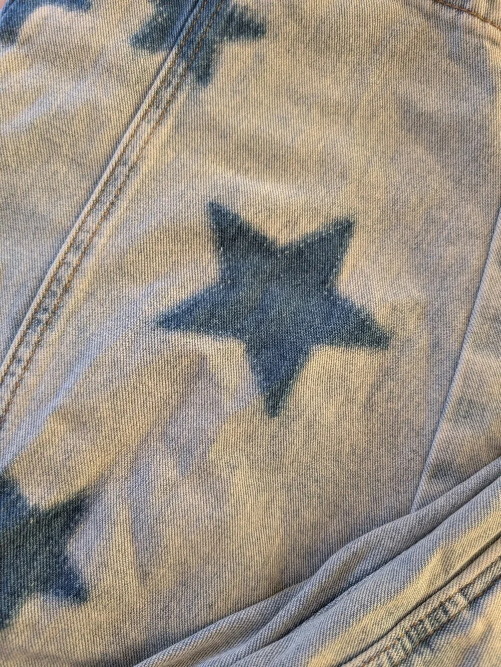 Star jeans, distressed light wash barrel style jeans